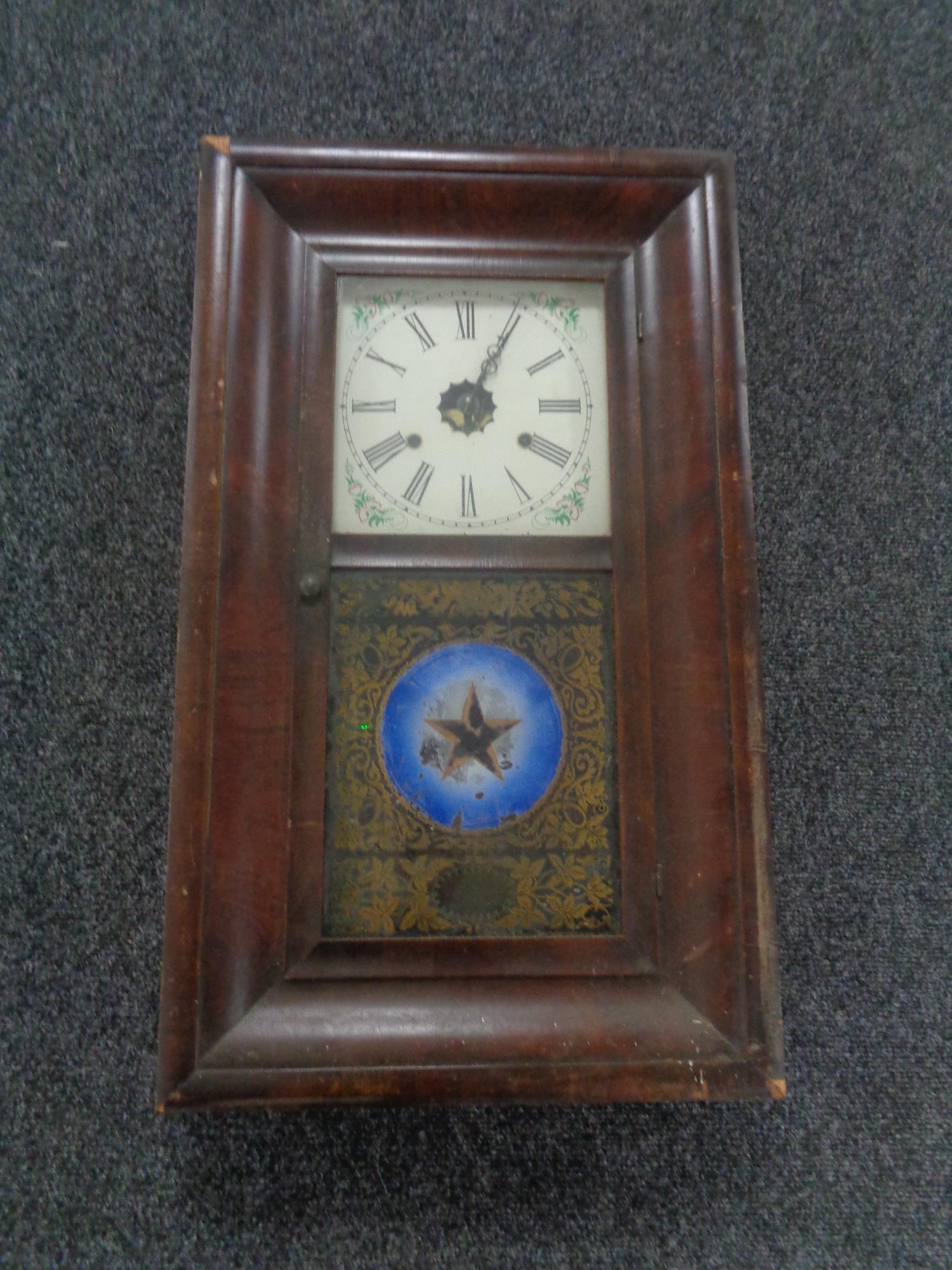 A nineteenth century mahogany cased American wall clock made by E.N.