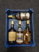 A basket containing four bottles of French brandy,