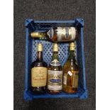 A basket containing four bottles of French brandy,