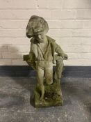 A concrete garden figure of a boy