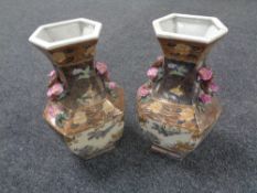 A pair of 20th century Japanese pottery vases depicting birds,