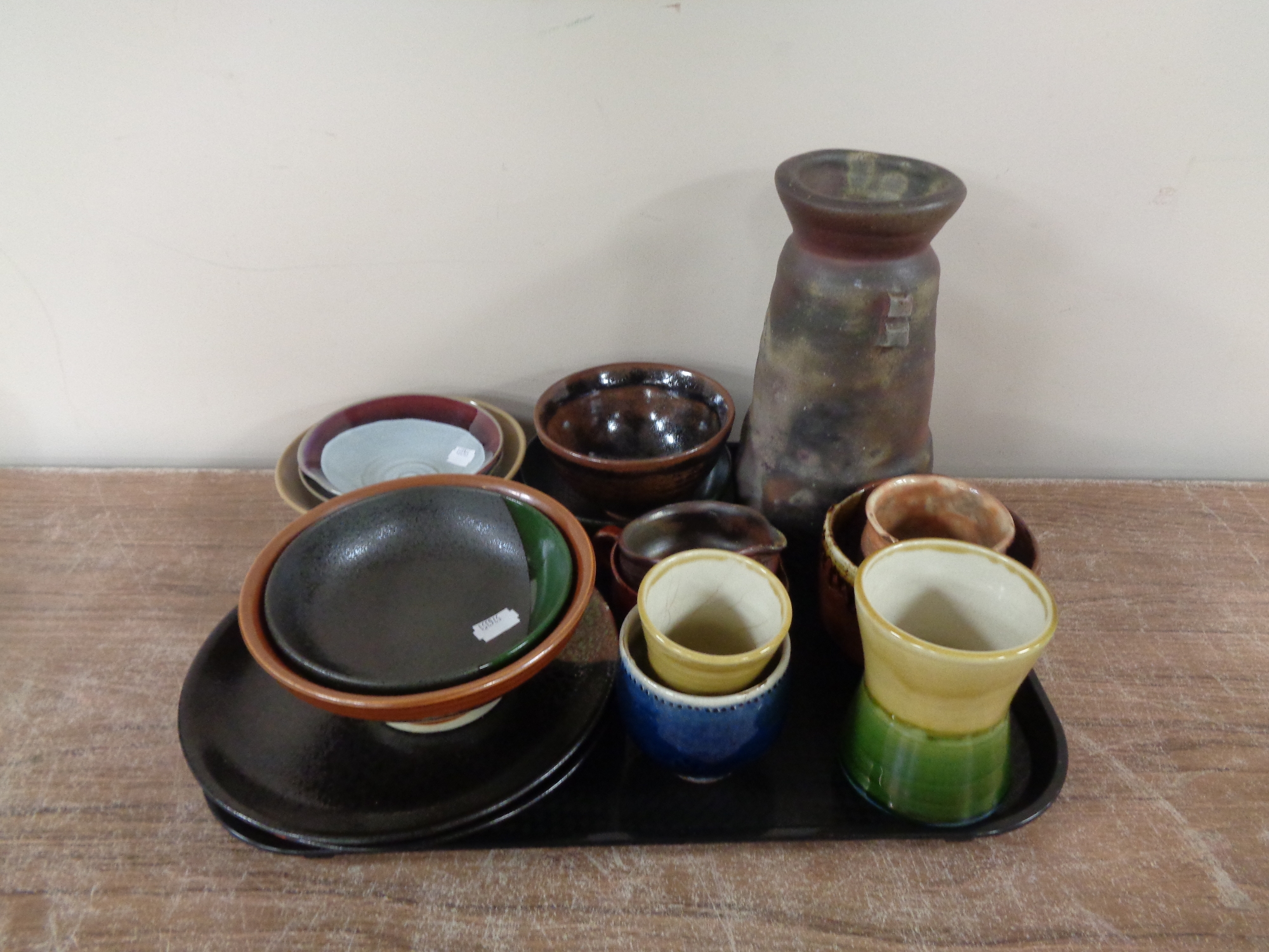 A tray containing 20th century and later glazed pottery vases, bowls, plates,