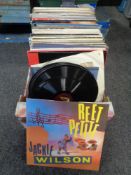 A box containing vinyl LPs to include War of the Worlds, Lionel Richie, Cliff Richard,