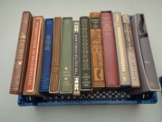 A basket containing 12 Folio Society volumes to include Robinson Crusoe,