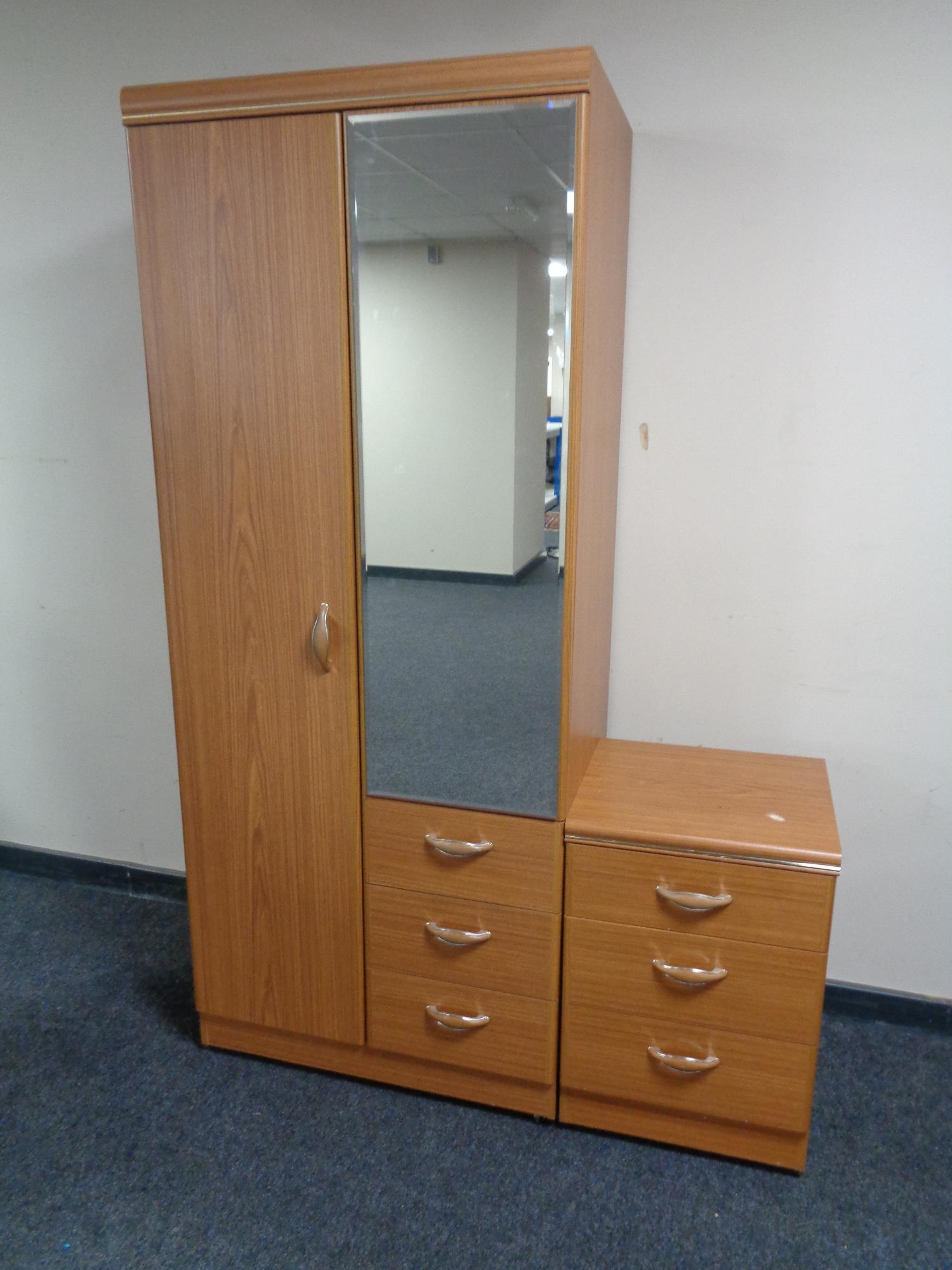 An Allston furniture combination wardrobe with matching three drawer bedside chest
