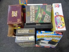 A box containing board games, Texas Hold'em and Black Jack set,