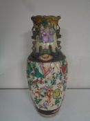 A 20th century Chinese glazed pottery vase depicting battle scene