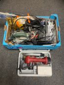 A cased electric handsaw together with further box containing power tools,