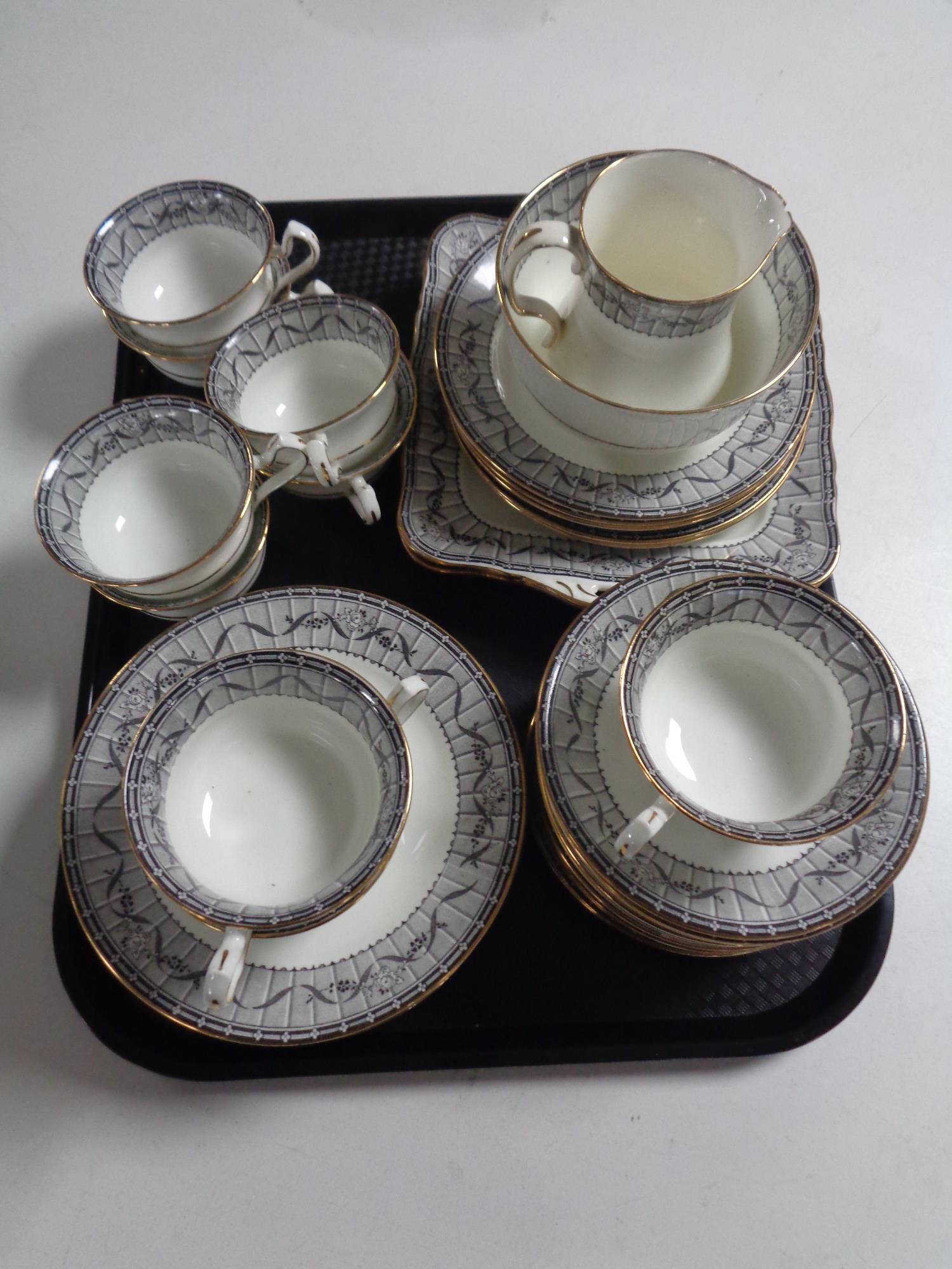 A tray containing a 37 piece Fenton china tea service