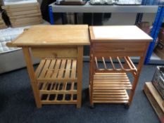 A pine tile top kitchen trolley with wine rack and shelves beneath,