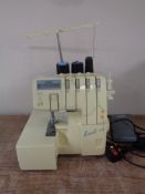 A Brother 640D overlocking sewing machine with foot pedal