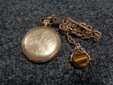 An antique gold plated Waltham pocket watch on chain with swivel fob