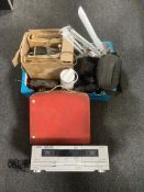 A box containing projectors, angle poise lamps, ion tape deck,