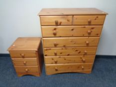 A contemporary pine effect seven drawer chest,