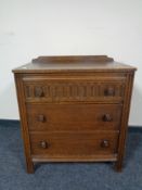 An oak three drawer chest