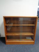 A set of mid twentieth century teak sliding glass door bookshelves