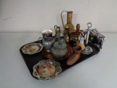 A tray containing assorted metal wares to include eastern brass jugs,