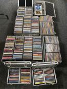 Eight aluminium cases containing a large quantity of assorted CDs