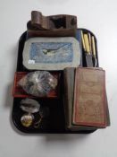 A tray containing glass paper weights, books, vintage ordinance survey map of Newcastle upon Tyne,