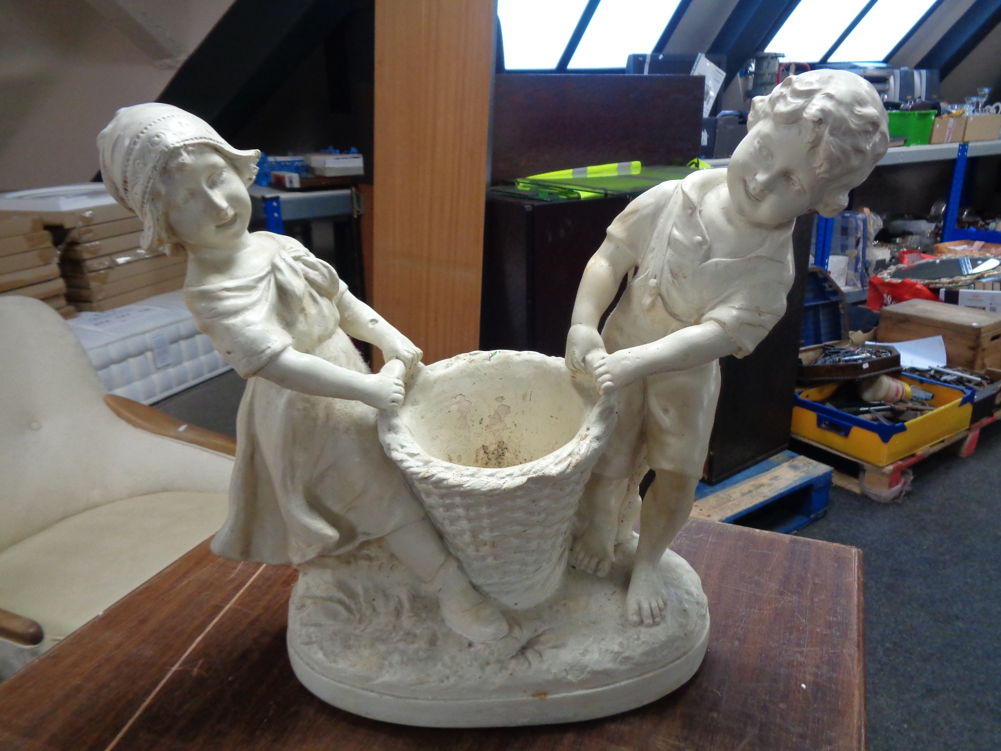 A twentieth century chalk planter modelled as a girl and boy with wicker basket, No.