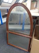 An antique oval mahogany wall mirror together with one other mirror
