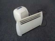 A dehumidifier together with an electric panel heater