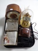 A tray containing a Kundo anniversary clock under shade, a walnut cased Smith mantle clock, camera,