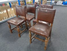 A set of four carved Edwardian oak dining chairs,