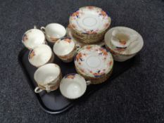 A tray containing a 38 piece antique china tea service