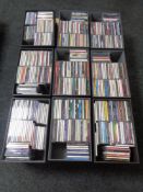 Nine contemporary leather lidded storage boxes containing various CDs