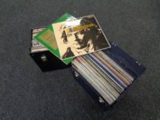 Two LP cases containing vinyl LPs,