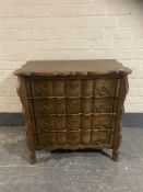 A continental oak shaped front four drawer chest with brass handles