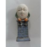 A cast iron Humpty Dumpty money box