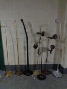 Seven assorted mid 20th century and later floor lamps (continental wiring)
