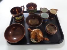 A tray containing nine pieces of antique copper lustre china