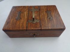 An Edwardian oak cigarette/cigar box with brass handle