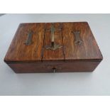 An Edwardian oak cigarette/cigar box with brass handle