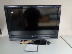 A Sony Bravia 32 inch LCD TV with lead and remote