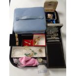 A tray containing costume jewellery, brooch and earrings, beaded necklaces, silver bangle, etc,
