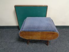 A mid twentieth century teak storage foot stool, upholstered in a blue dralon,