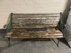 A cast iron wooden slatted garden bench (a/f)