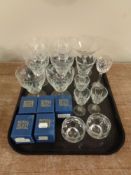 A tray containing assorted etched drinking glasses, Edinburgh crystal liqueur glass,