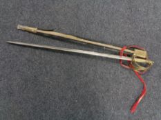 An Indian brass handled sword in scabbard