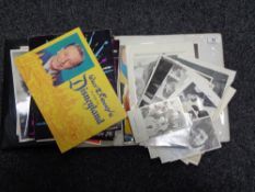 A folder containing memorabilia to include signed pictures of film and music stars,