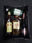 A basket containing a bottle of Cassons gin, two bottles of brandy,