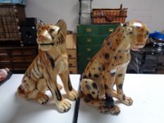 Two chalk figures of a tiger and a cheetah