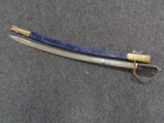 An Indian brass handled sword in scabbard