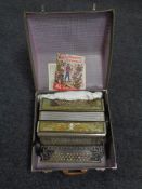 A Ditta Salas Stradella piano accordion with music books in case
