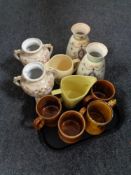 A tray containing Nelson pottery tankards, Wade whiskey jugs,