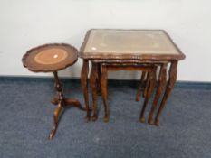 A nest of three leather topped tables on cabriole legs together with a wine table with a leather
